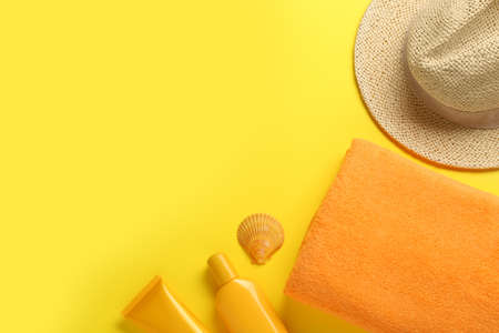 Flat lay composition with different beach objects on yellow background, space for textの写真素材