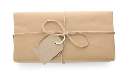Parcel wrapped with kraft paper, twine and tag isolated on white, top viewの写真素材