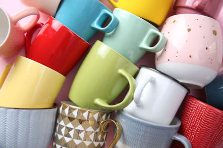 Many different cups on pink background, flat lay. Diversity conceptの写真素材