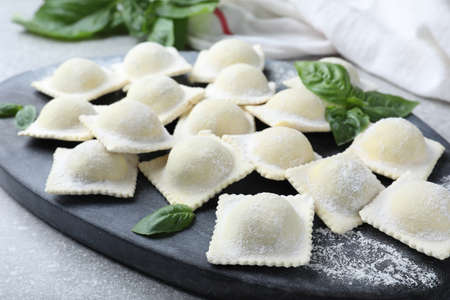 Homemade uncooked ravioli on board closeup viewの写真素材