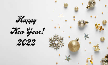 Happy New 2022 Year! Flat lay composition with decorations on white background