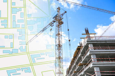 Double exposure of cadastral map and unfinished buildingの写真素材