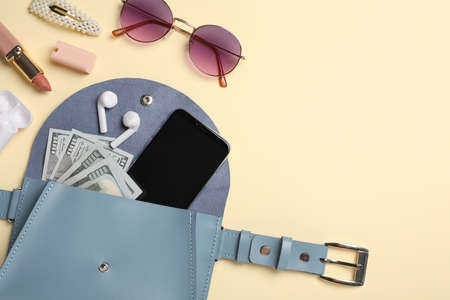 Flat lay composition with stylish woman's bag on beige background. Space for textの写真素材