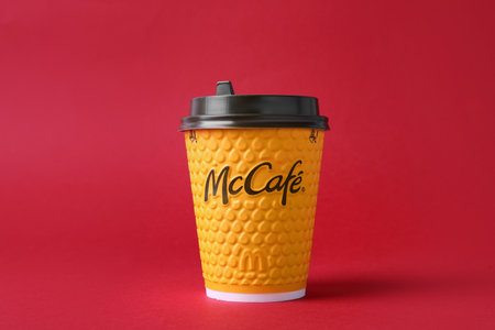 MYKOLAIV, UKRAINE - AUGUST 12, 2021: Hot McDonald's drink on red backgroundのeditorial素材
