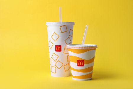 MYKOLAIV, UKRAINE - AUGUST 12, 2021: Cold McDonald's drinks on yellow backgroundのeditorial素材