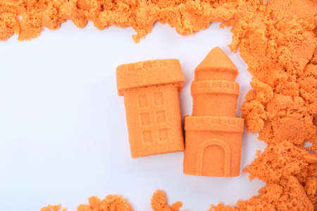 Castle and tower made of kinetic sand on white background, top viewの写真素材