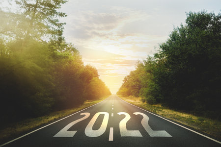 Start new year with fresh vision and ideas. 2022 numbers on asphalt roadの写真素材