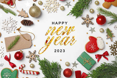 Happy New 2023 Year! Frame made with festive decor on white background, top view