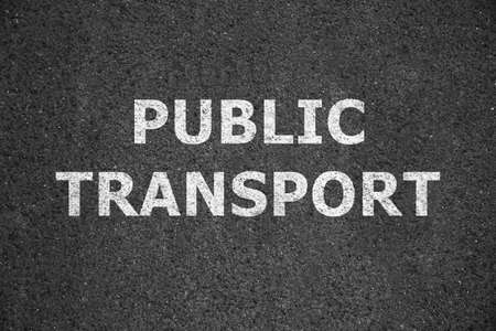 Text PUBLIC TRANSPORT written on asphalt road, top viewの写真素材