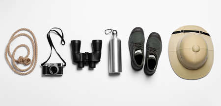 Flat lay composition with different safari accessories on white backgroundの写真素材