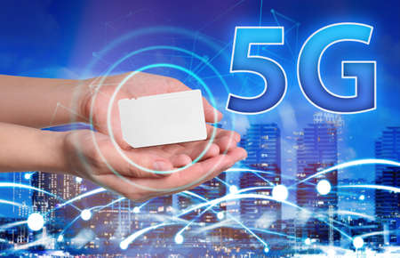 Woman demonstrating 5G SIM card model and cityscape with connection lines on background, closeup