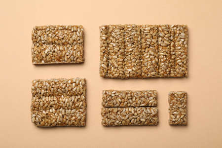 Delicious kozinaki bars on beige background, flat layの写真素材