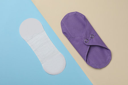 Pantyliner and reusable menstrual pad on color background, flat layの写真素材