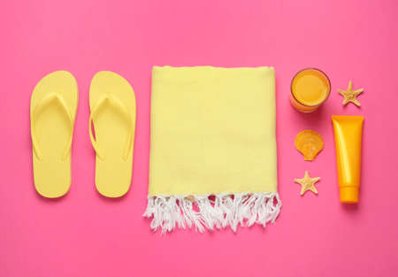 Flat lay composition with different beach objects on pink backgroundの写真素材