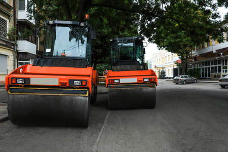 Modern rollers on city street. Road repair serviceの写真素材