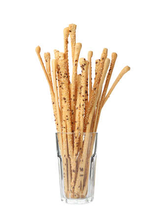 Delicious grissini sticks in glass on white backgroundの写真素材