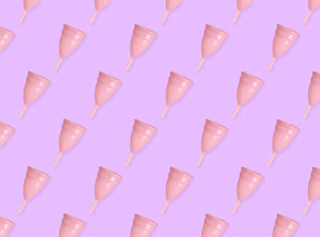 Many menstrual cups on pink background, flat lay. Pattern designの写真素材