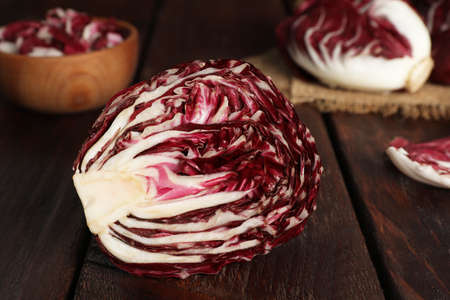 Half of ripe radicchio on wooden tableの写真素材