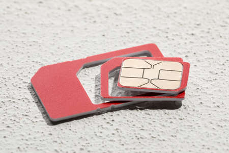 Multi SIM card on stone background, closeupの写真素材