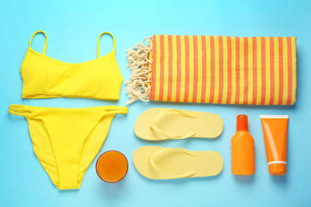 Flat lay composition with different beach objects on light blue backgroundの写真素材