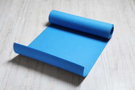 Bright camping mat on white wooden backgroundの写真素材