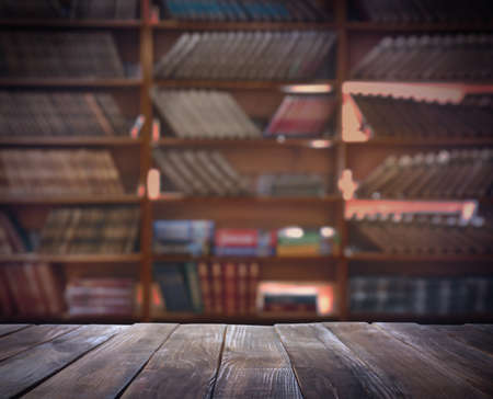 Empty wooden table in library. Space for design