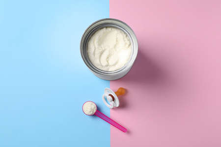 Flat lay composition with powdered infant formula on color background. Baby milkの写真素材
