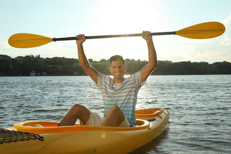 Happy man kayaking on river. Summer activityの写真素材