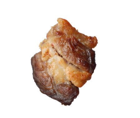 Tasty fried crackling isolated on white. Cooked pork lardの写真素材