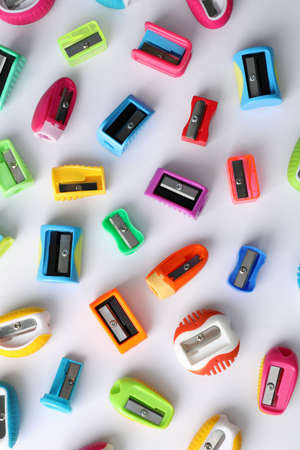 Many different colorful sharpeners on white background, flat lay. Diversity conceptの写真素材