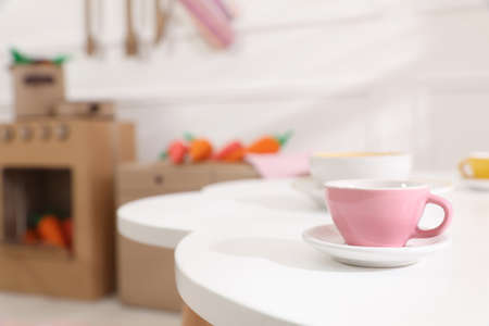 Cup on white table in kitchen, space for textの写真素材