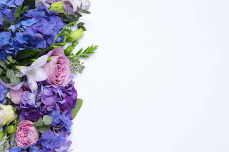 Beautiful composition with hortensia flowers on white background, flat lay. Space for textの写真素材