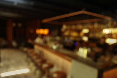 Blurred view of stylish modern bar interior with bokeh effectの写真素材