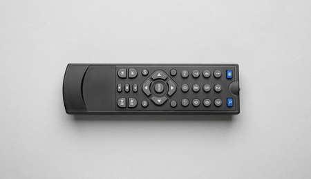 Remote control on light gray background, top view