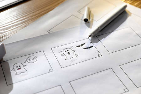 Storyboards with cartoon sketches at workplace.の写真素材