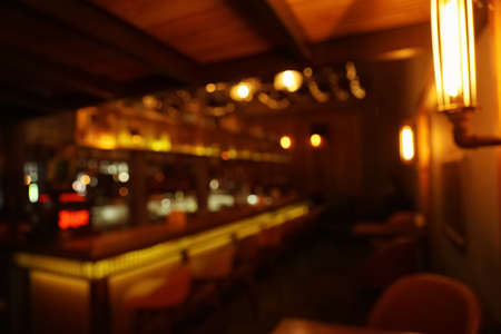 Blurred view of stylish modern bar interior with bokeh effectの写真素材