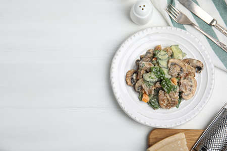 Delicious salad with mayonnaise on white table, flat lay. Space for textの写真素材