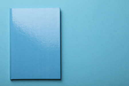 New bright planner on light blue background, top view. Space for textの写真素材