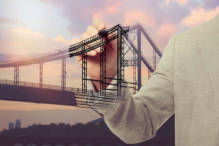Man drawing picture of bridge, closeup. Business cooperation concept