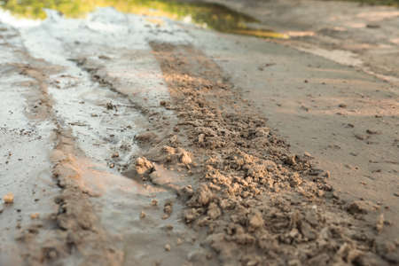 View of textured ground mud outdoors on sunny dayの写真素材