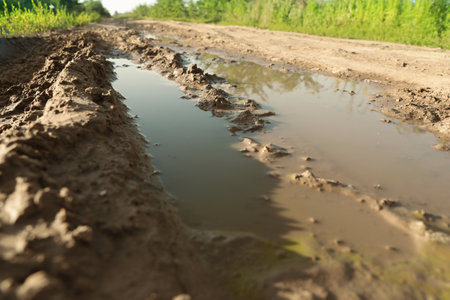 View of textured ground mud outdoors on sunny dayの写真素材