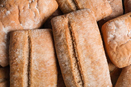 Many delicious ciabattas as background, top viewの写真素材