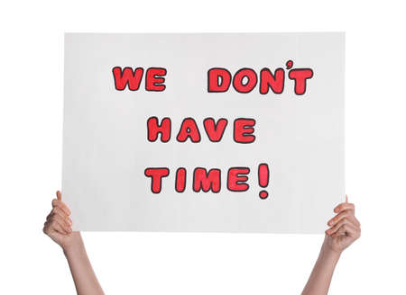 Protestor holding placard with text We Don't Have Time on white background, closeup. Climate strikeの写真素材