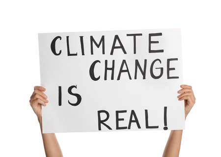 Protestor holding placard with text Climate Change Is Real on white background, closeupの写真素材