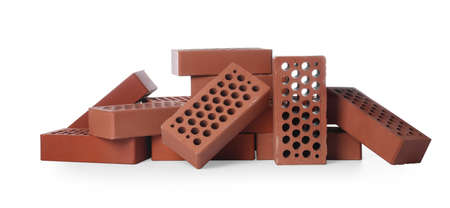 Pile of red bricks on white background. Building materialの写真素材