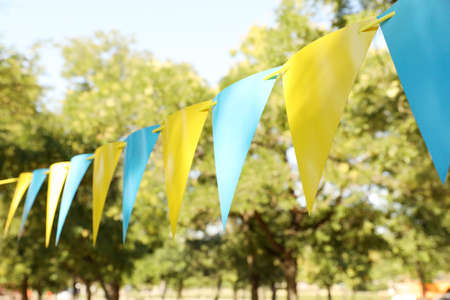 Colorful bunting flags in park. Party decorの写真素材