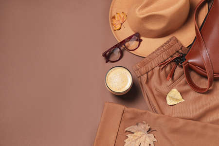Flat lay composition with stylish hat on brown background, space for textの写真素材