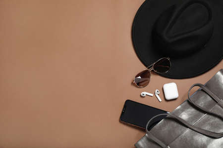 Flat lay composition with stylish hat on brown background, space for textの写真素材