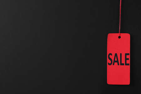 Sale red tag on color background, space for text. Black Fridayの写真素材