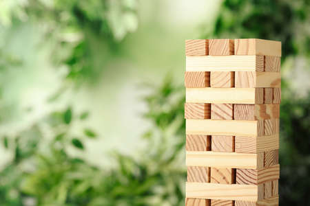 tower made of wooden blocks outdoors. Space for textの写真素材